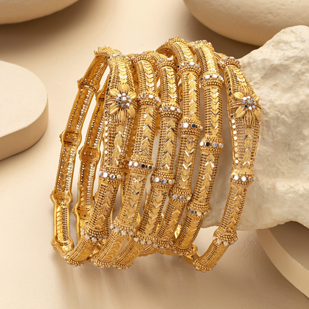 Fine gold bangle set by Hibaat