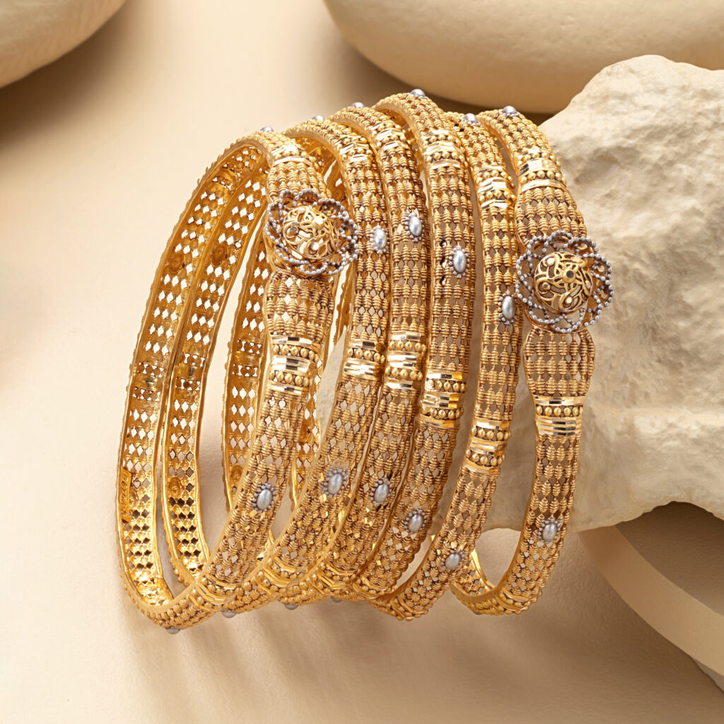 Fine gold bangle set by Hibaat