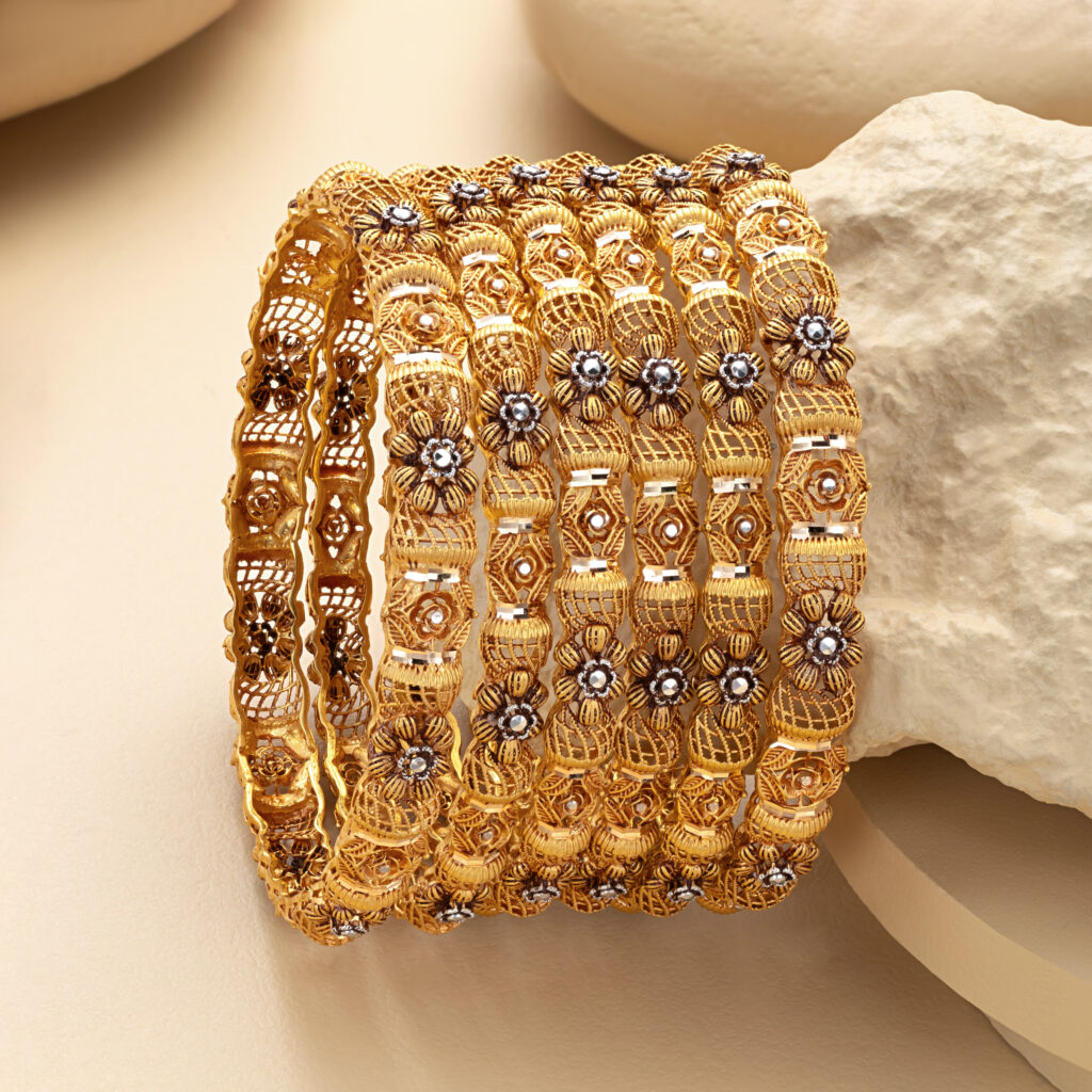 Fine gold bangle set by Hibaat