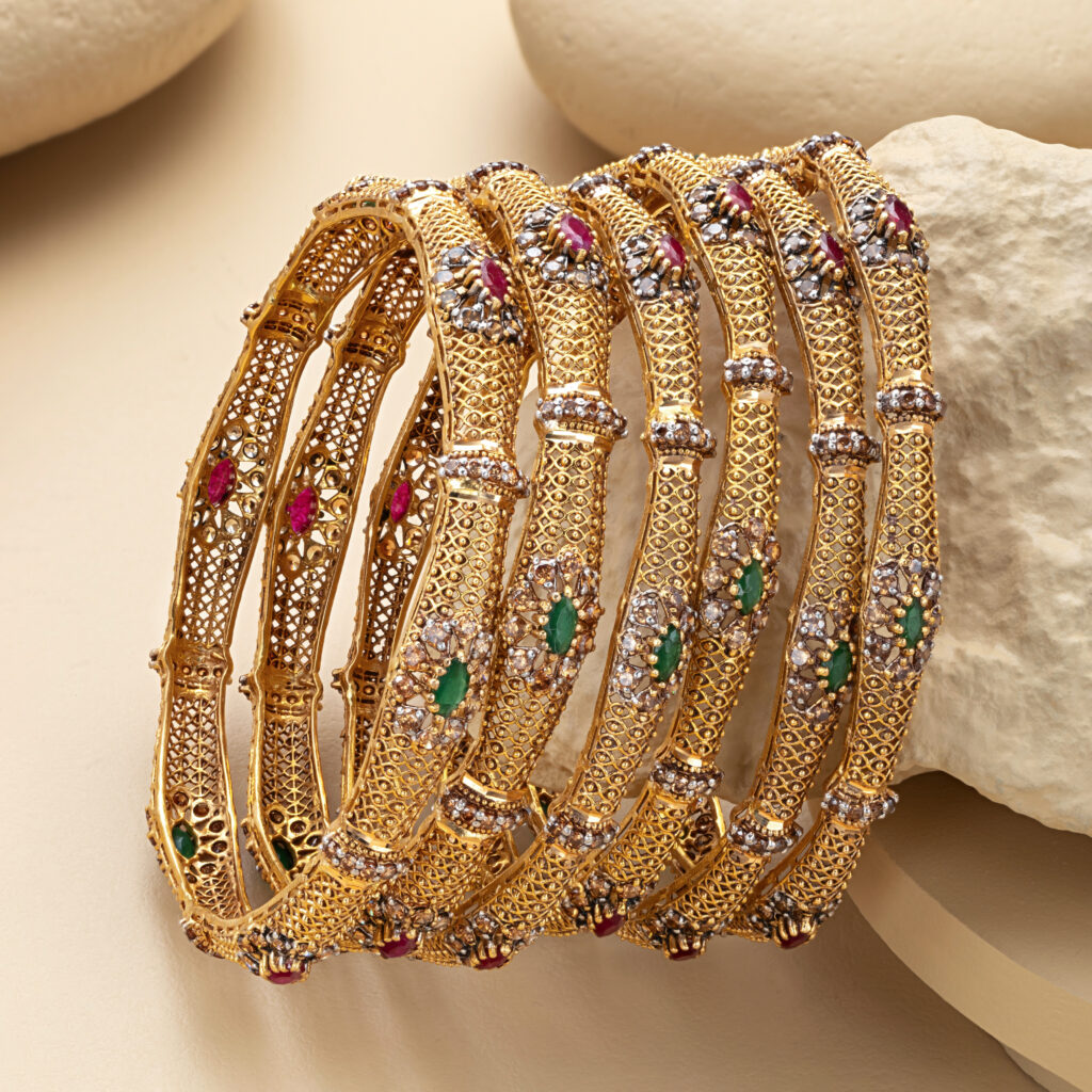 Fine gold bangle set by Hibaat