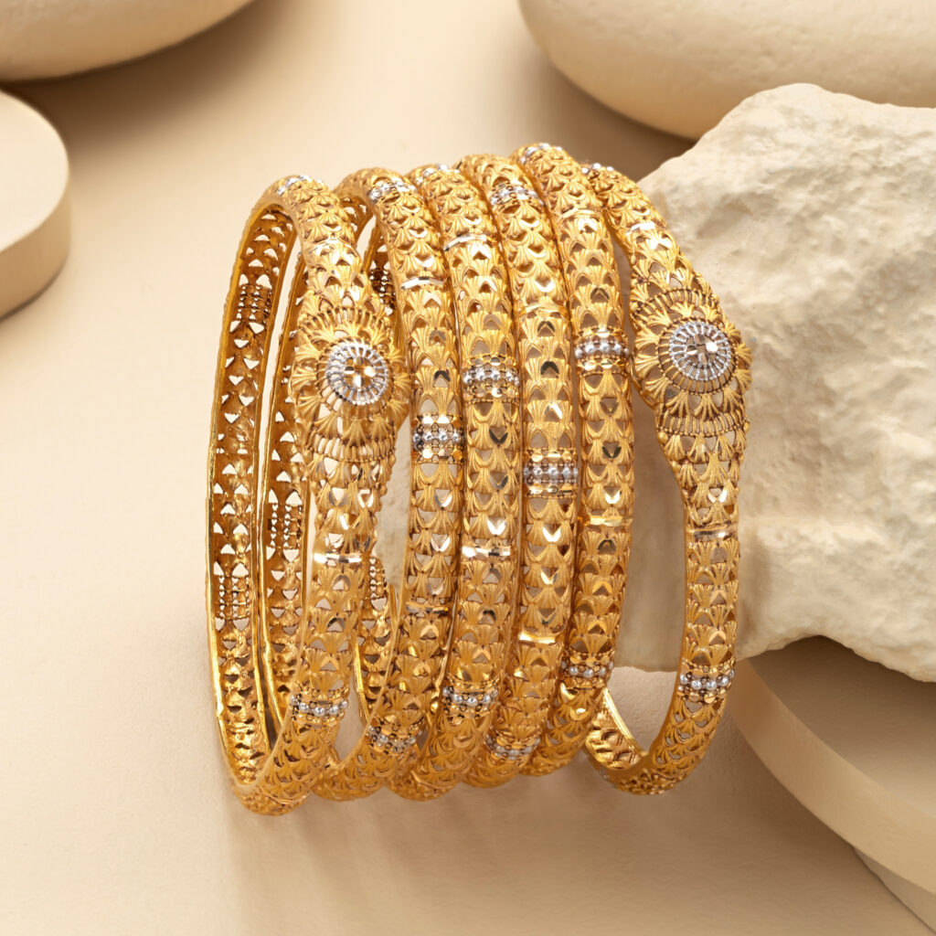 Fine gold bangle set by Hibaat