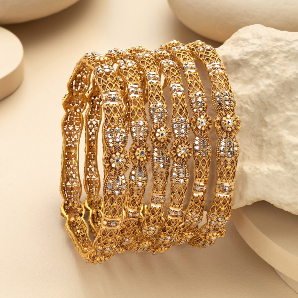 Fine gold bangle set by Hibaat