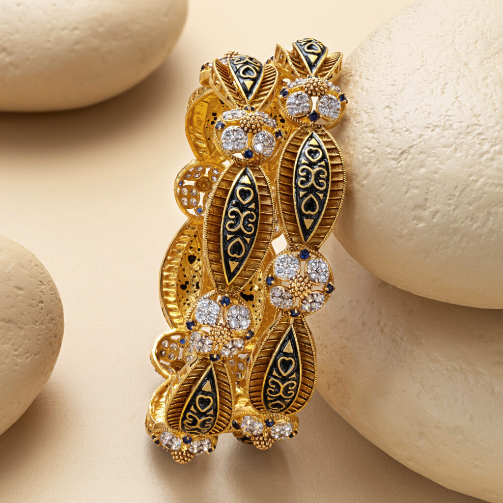 Fine gold bangle set by Hibaat