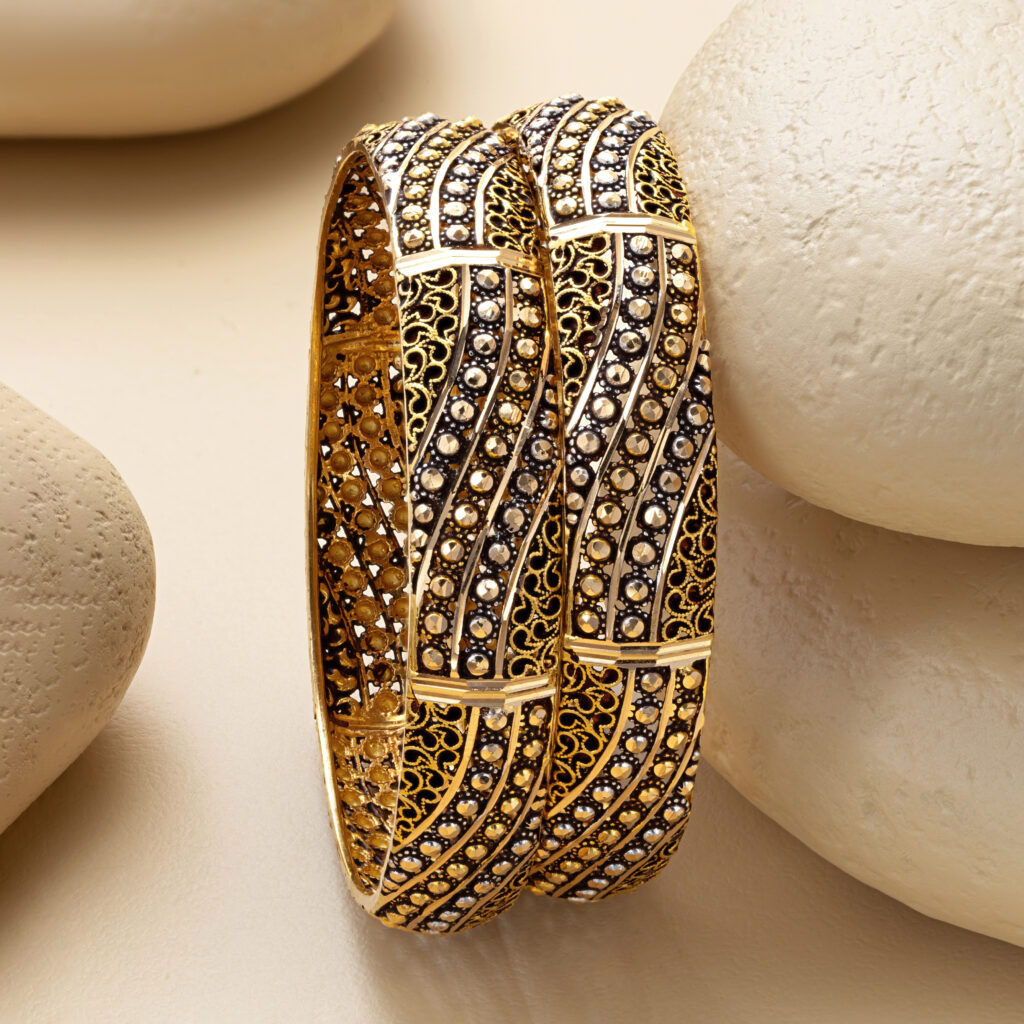 Fine gold bangle set by Hibaat