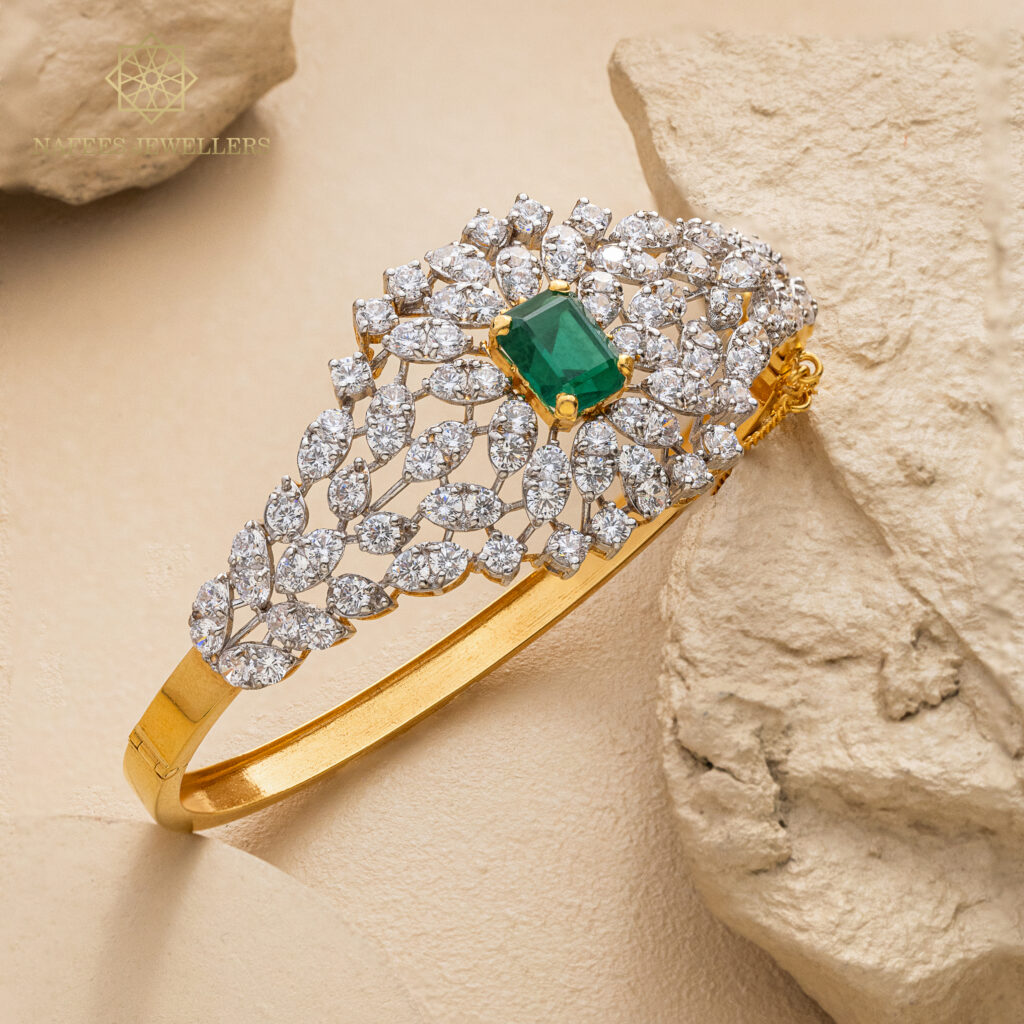 Fine gold emerald bangle by Hibaat
