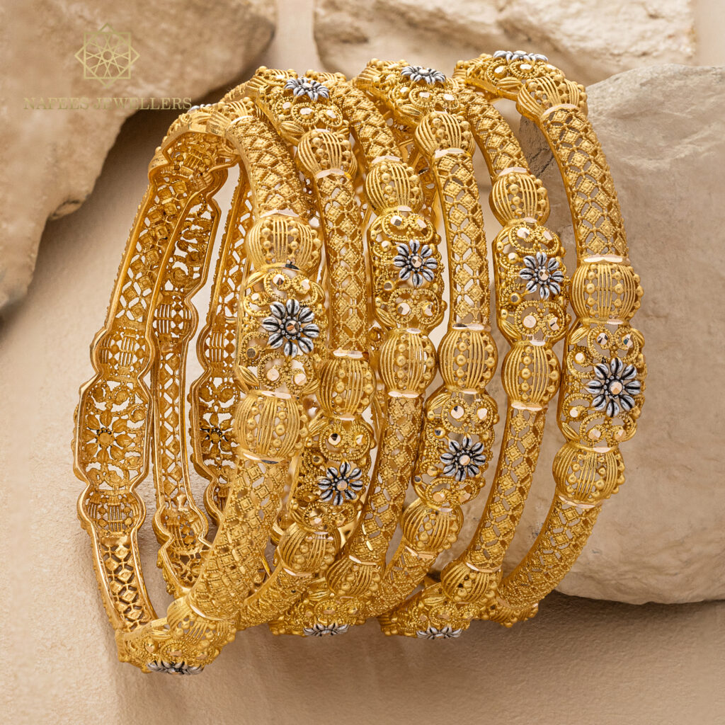 Fine gold bangle set by Hibaat