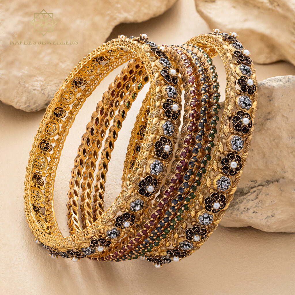 Fine gold bangle set by Hibaat