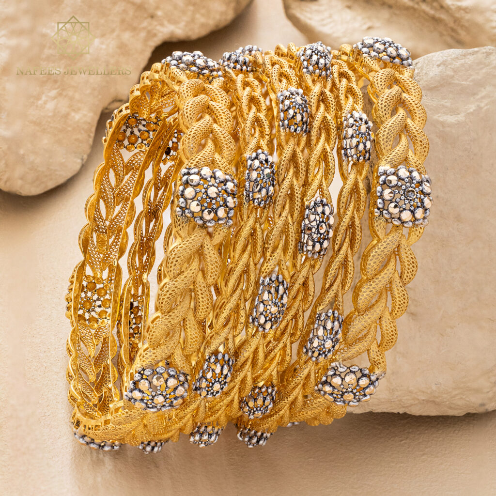 Fine gold bangle set by Hibaat