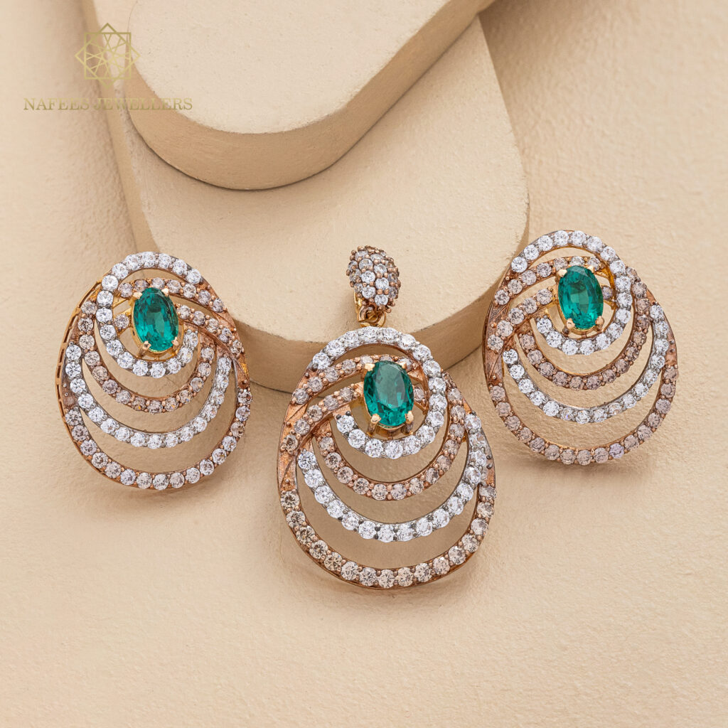 Fine gold emerald earrings by Hibaat