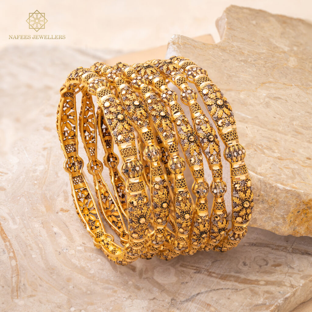 Fine gold bangle set by Hibaat