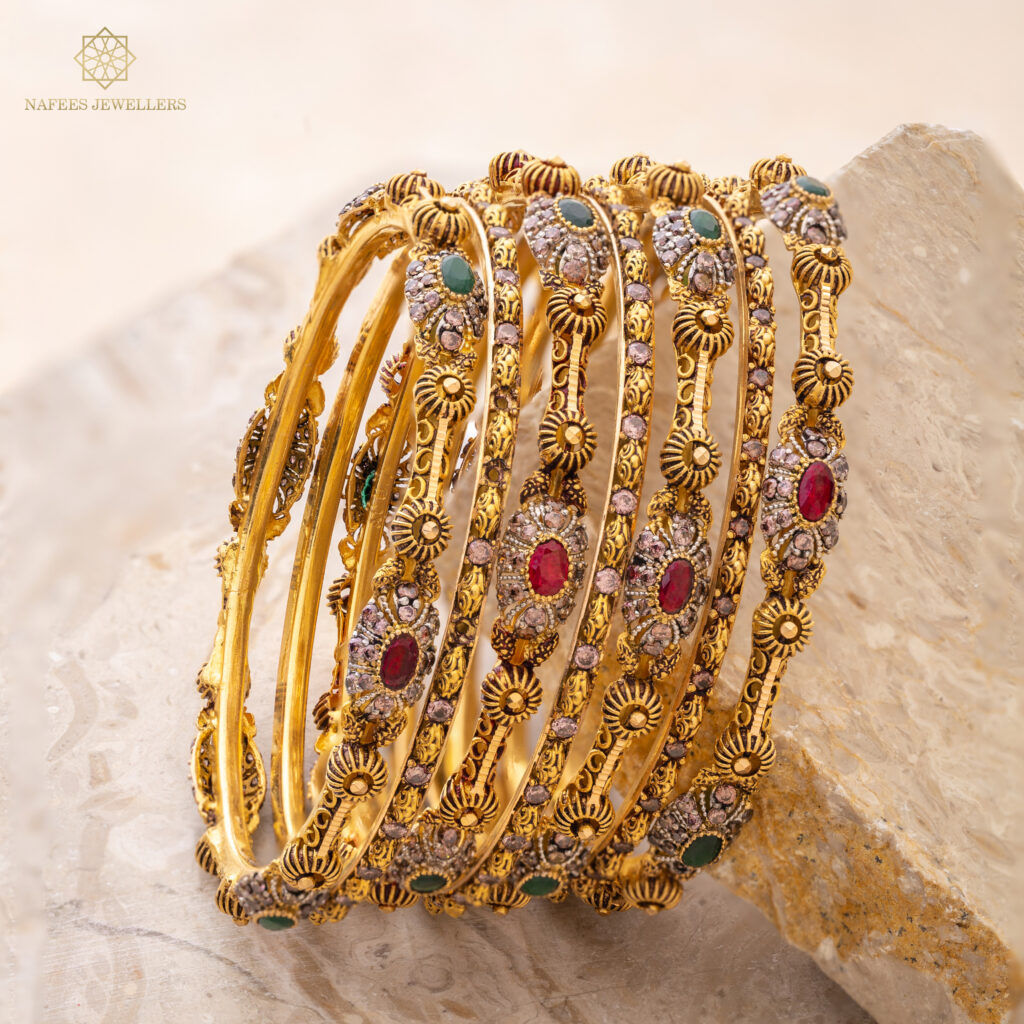 Fine gold bangle set by Hibaat