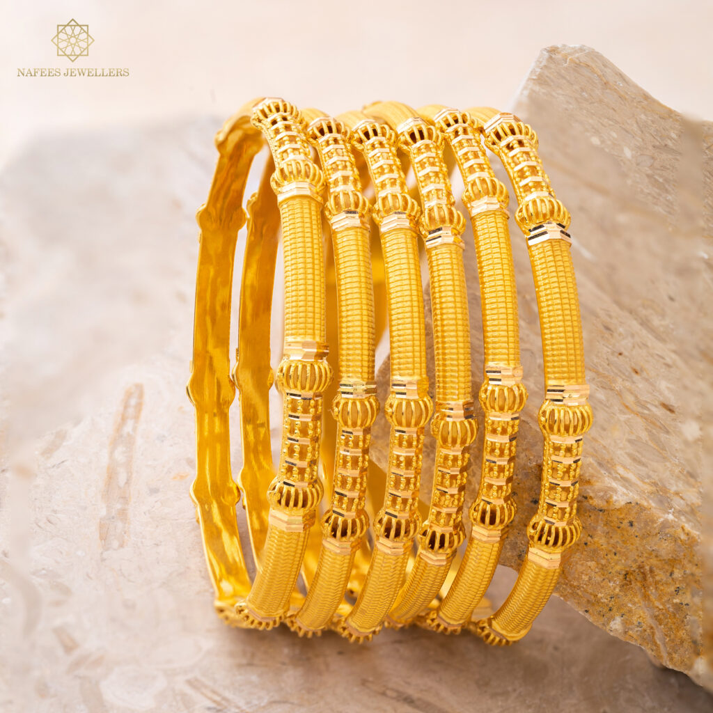 Fine gold bangle set by Hibaat