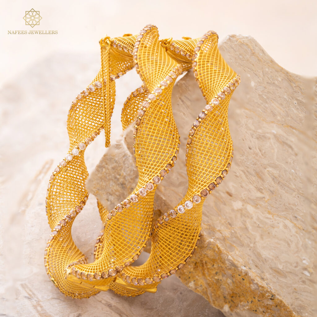 Fine gold bangle set by Hibaat