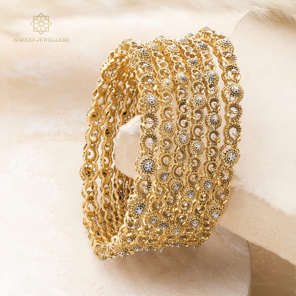 Fine gold bangle set by Hibaat