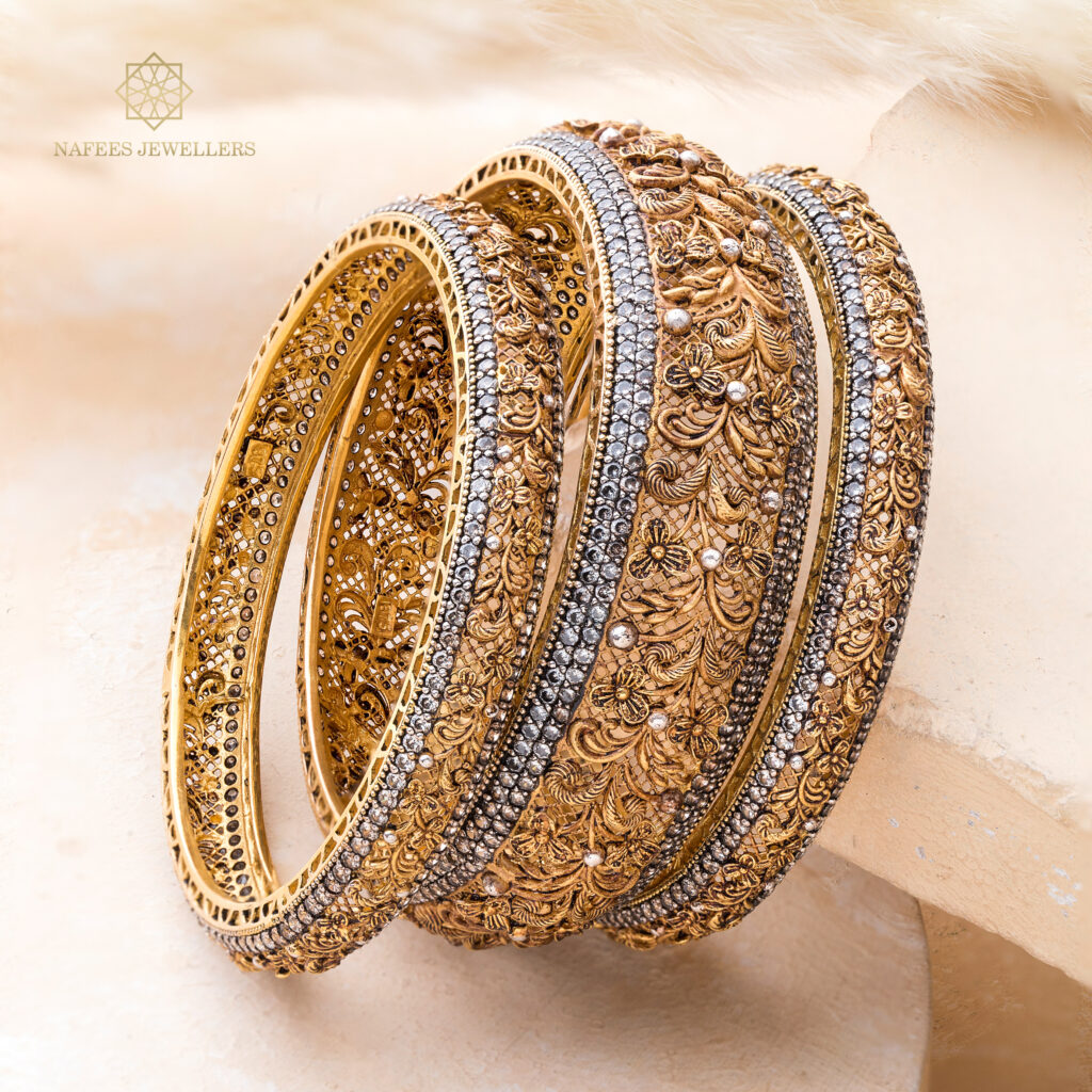Fine gold bangle set by Hibaat