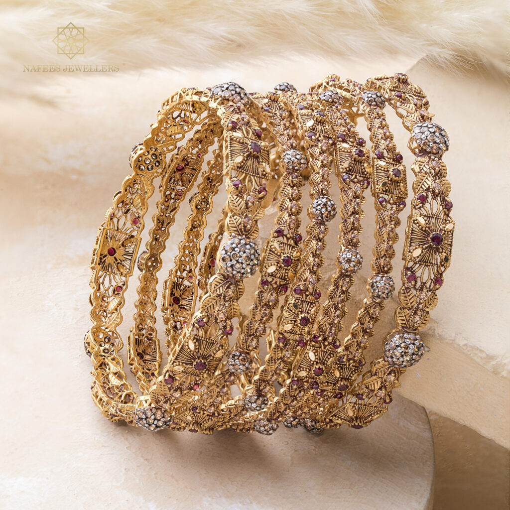 Fine gold bangle set by Hibaat