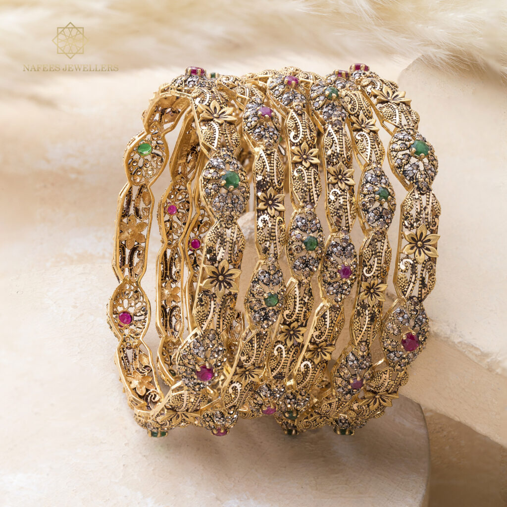 Fine gold bangle set by Hibaat