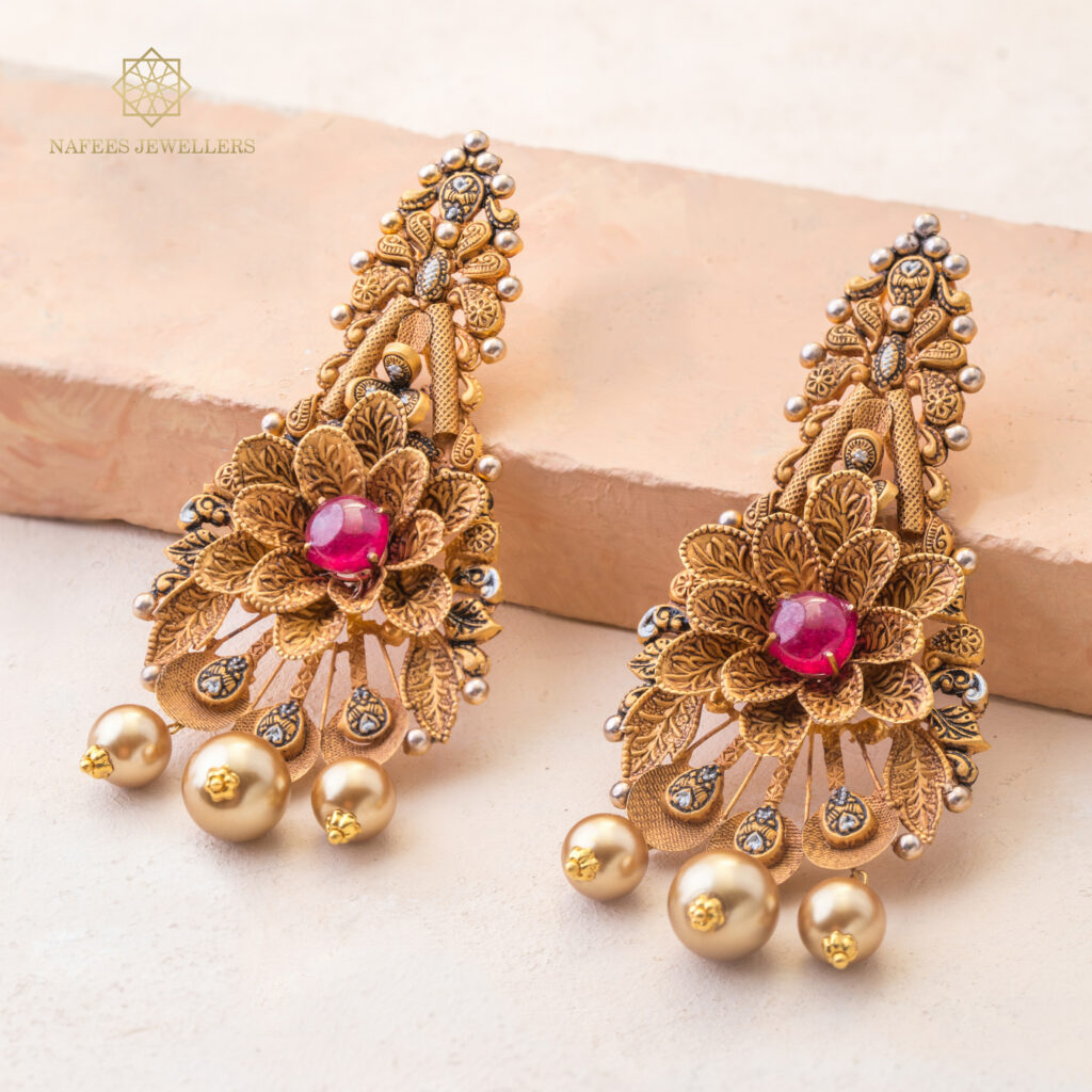Fine gold ruby earrings by Hibaat