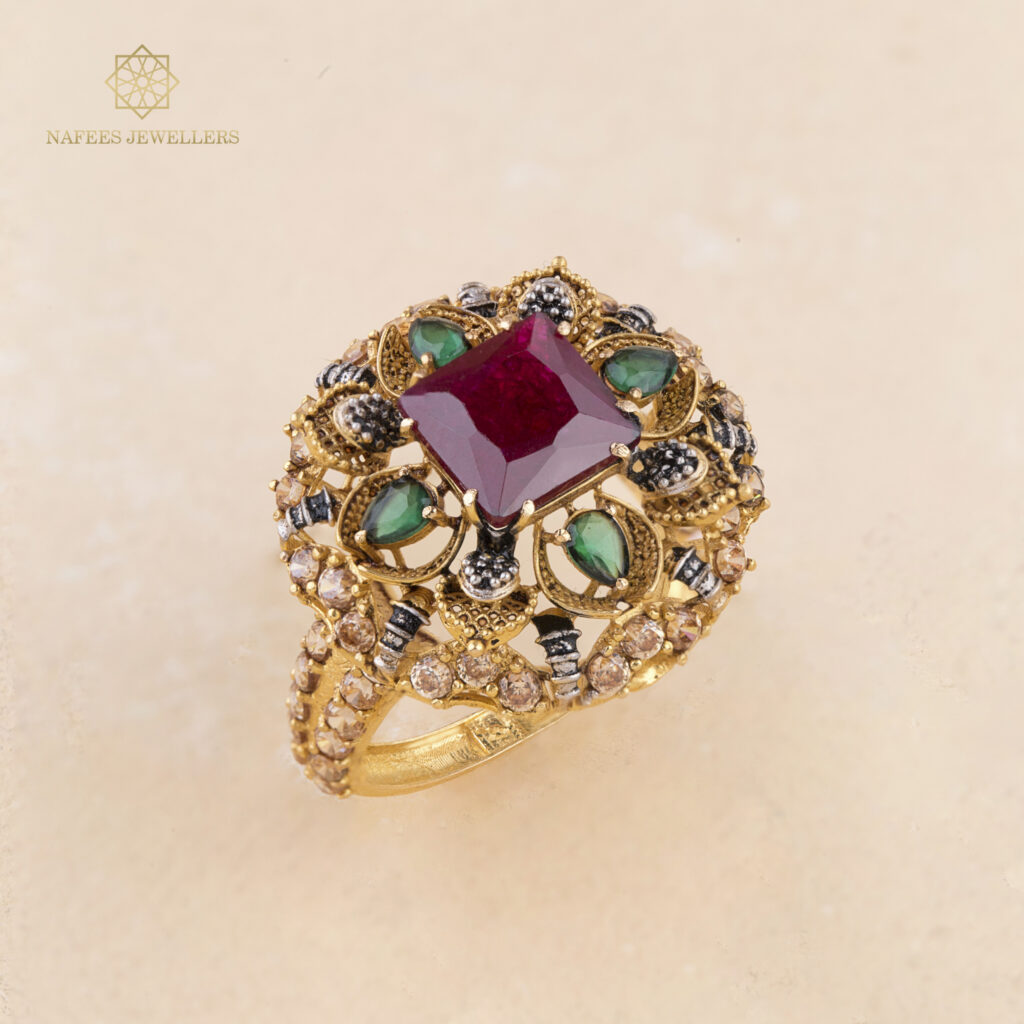 Fine gold ruby and emerald ring by Hibaat