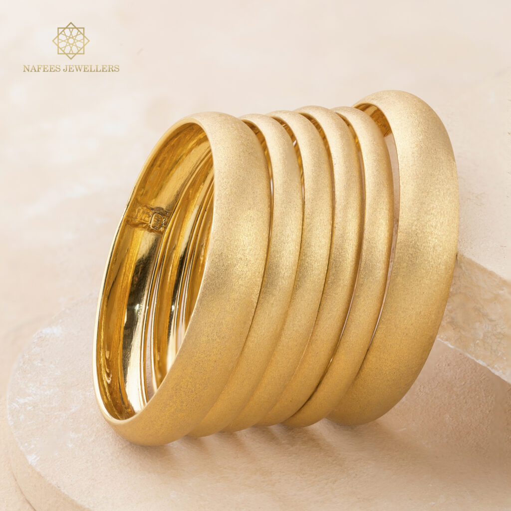 Fine gold bangle set by Hibaat