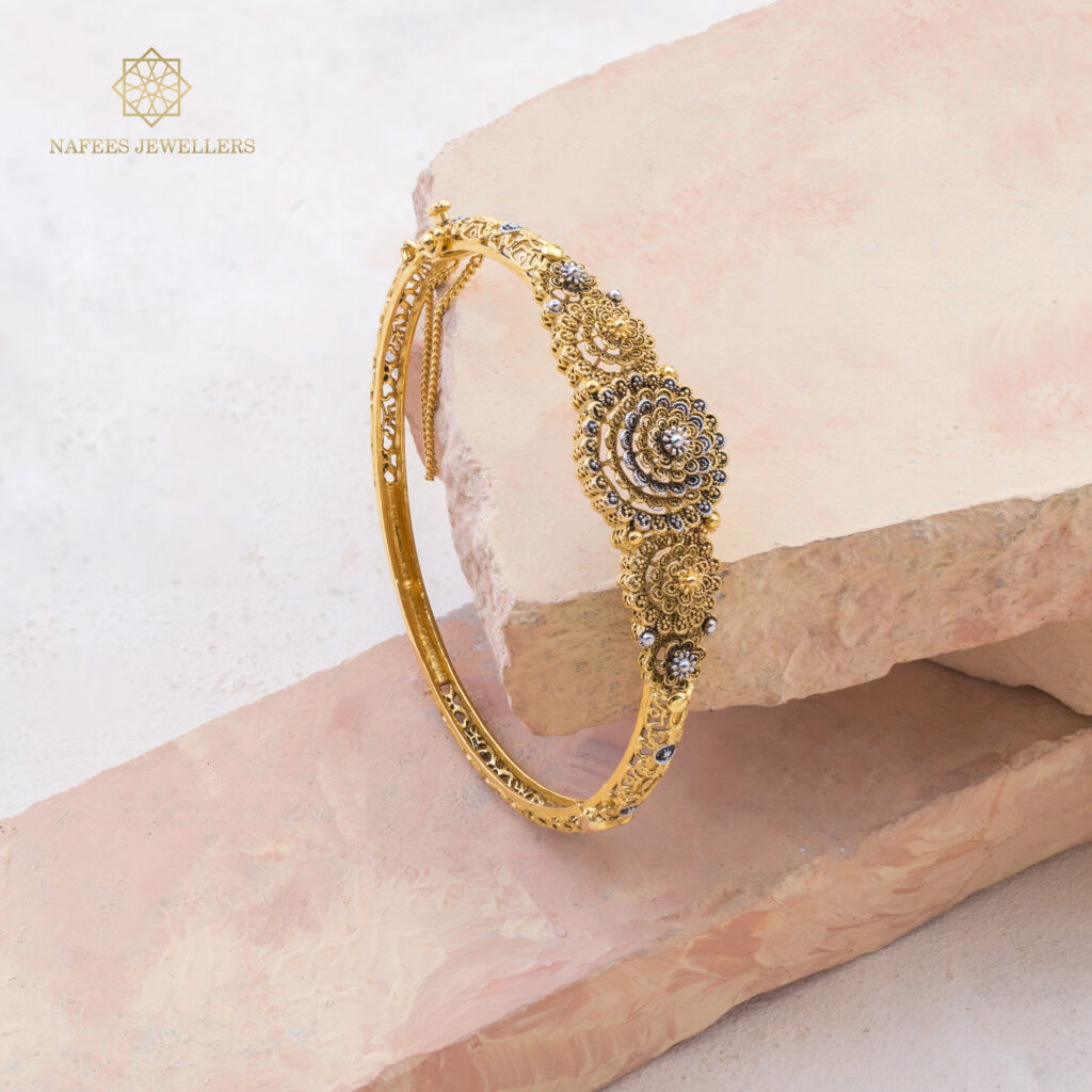 Fine gold sapphire bangle by Hibaat