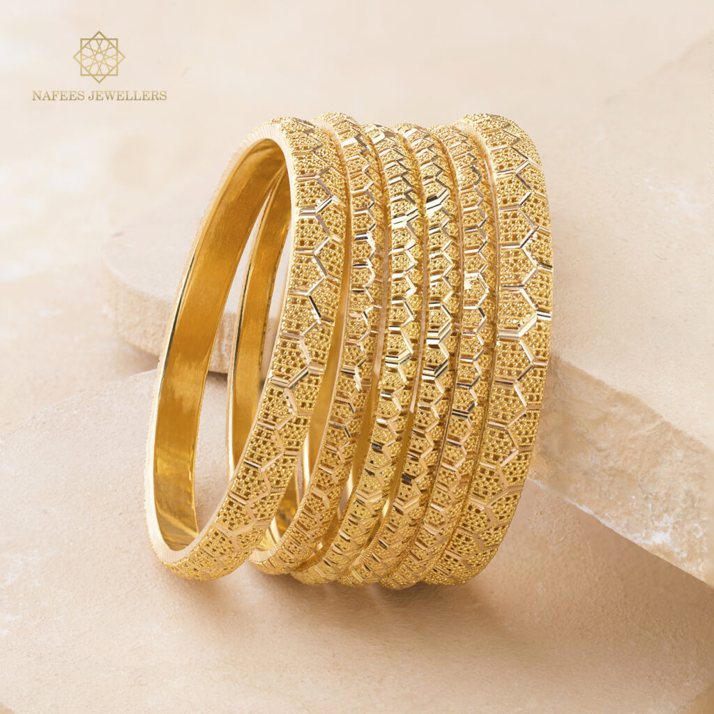 Fine gold bangle set by Hibaat