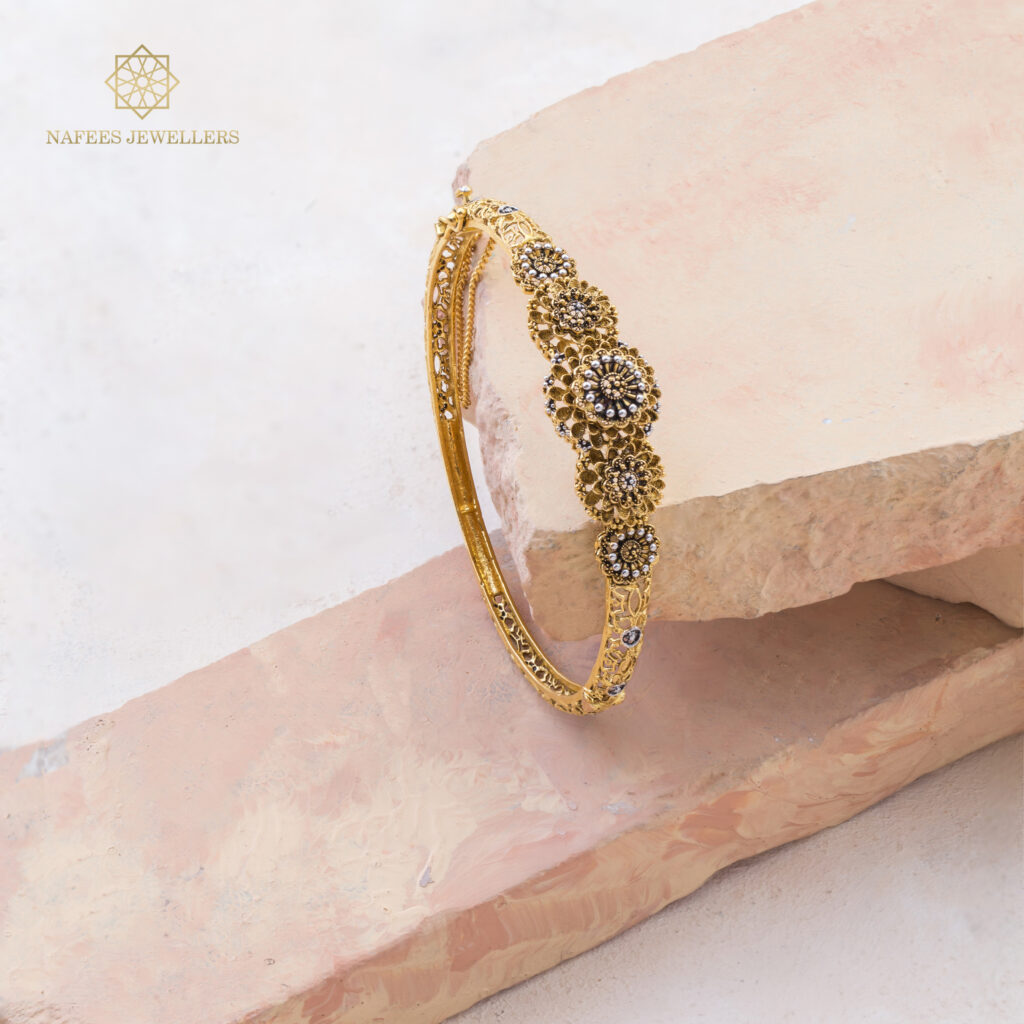 Fine gold sapphire bangle by Hibaat