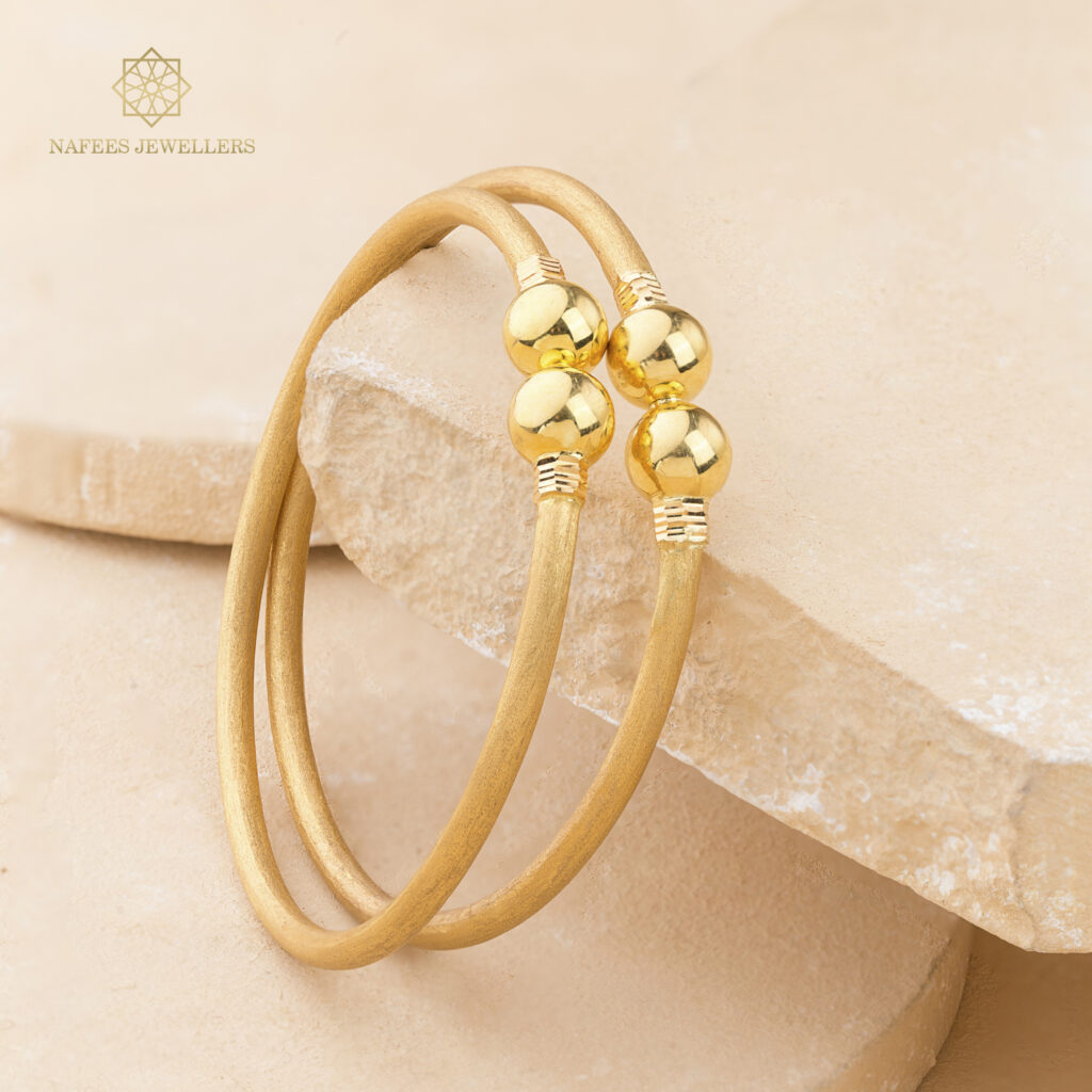 Fine gold bangle set by Hibaat